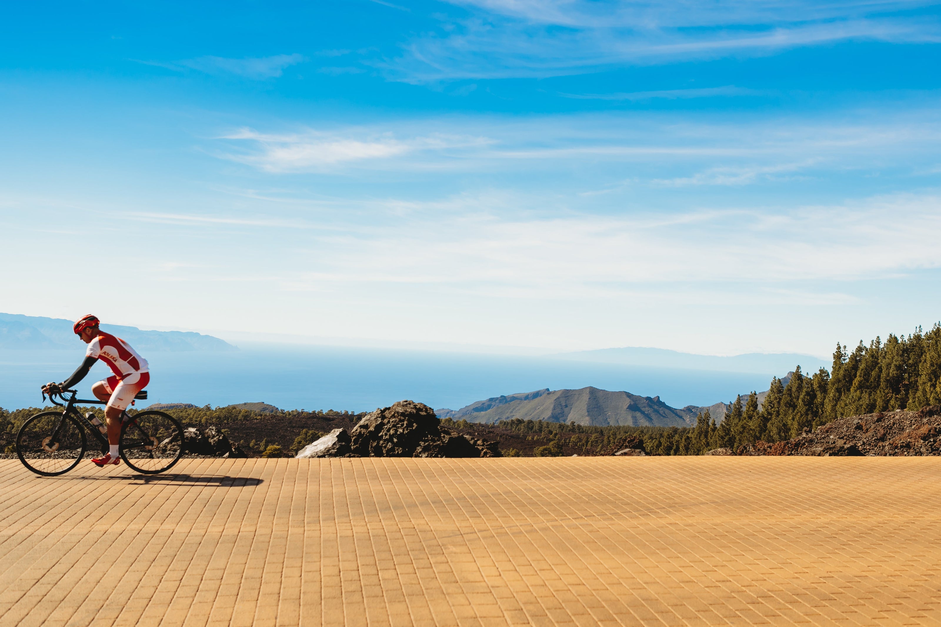 blue-sky-behind-road-cyclist